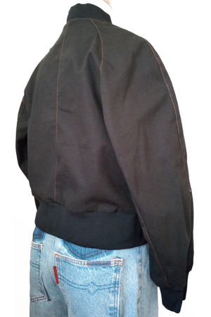 Back view of black ripstop bomber jacket with raglan sleeves